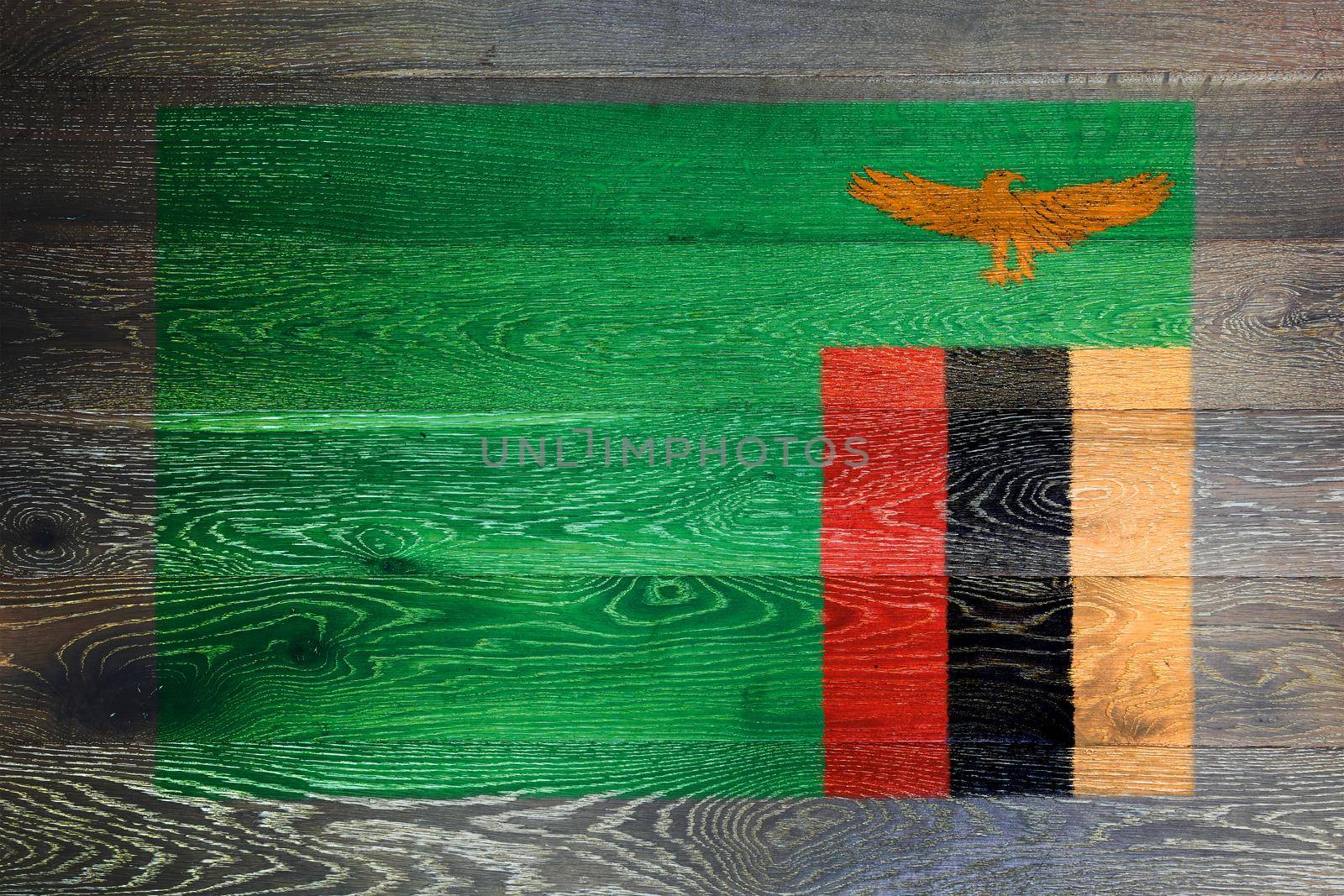 A Zambia flag on rustic old wood surface background