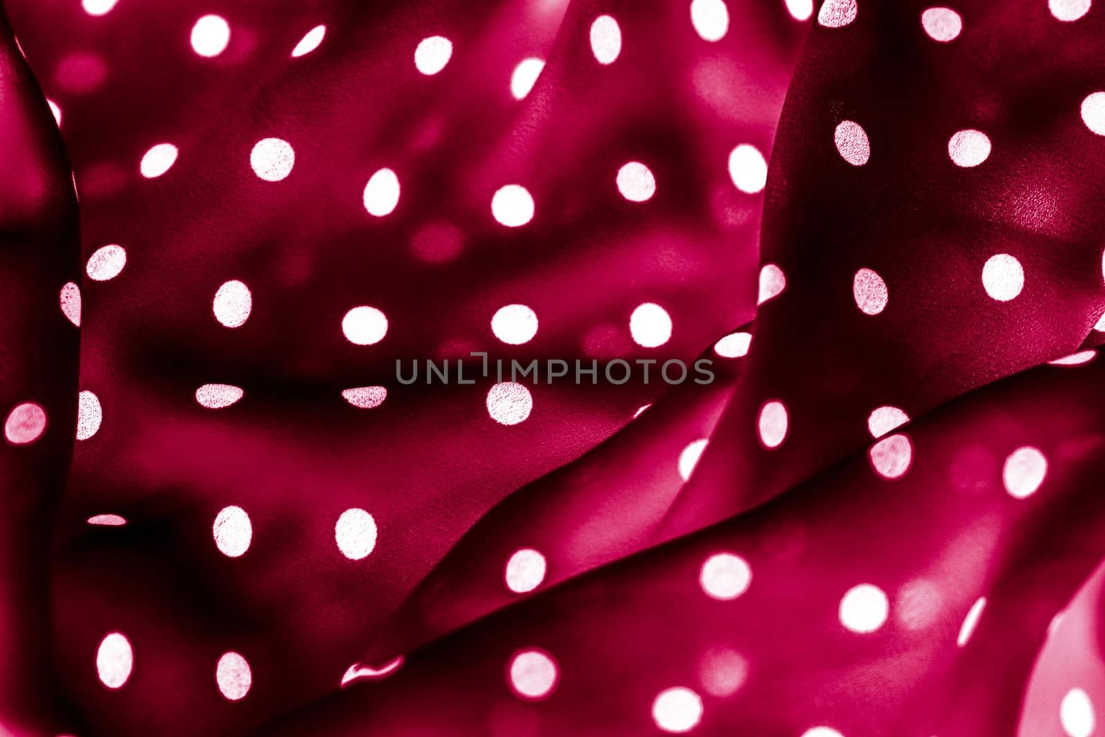 Classic polka dot textile background texture, white dots on red luxury fabric design pattern by Anneleven