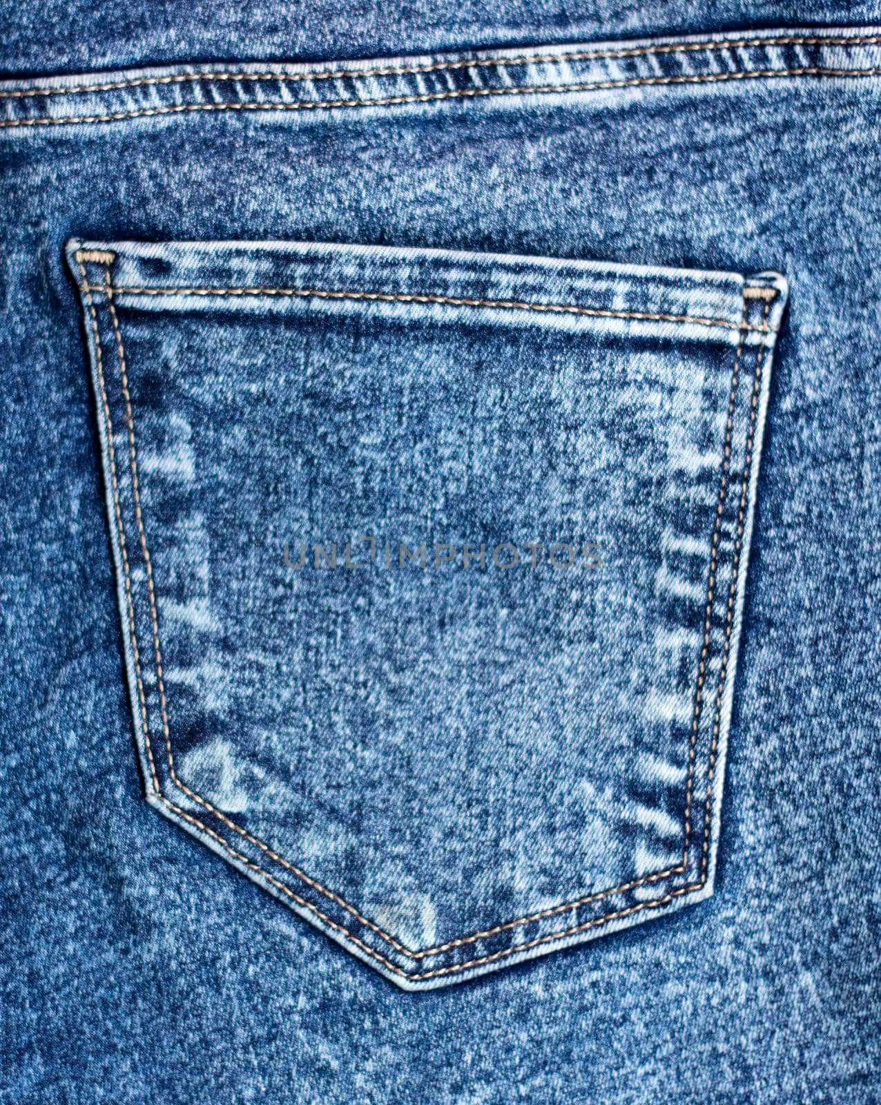 back pocket on jeans. Denim fabric texture. Sewn-in pocket, empty. High quality photo