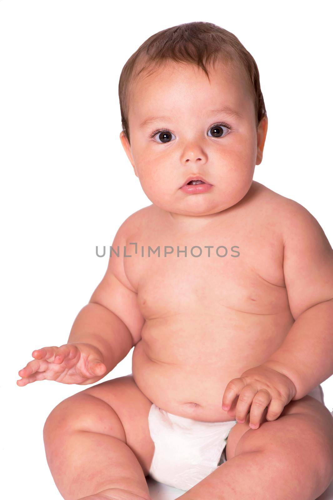 Little baby boy lying on the bed on white background by aprilphoto