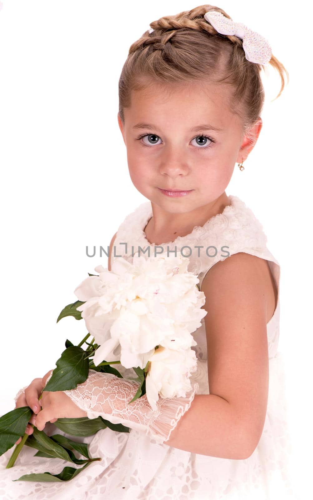 Happy little girl giving peony flowers on white background by aprilphoto