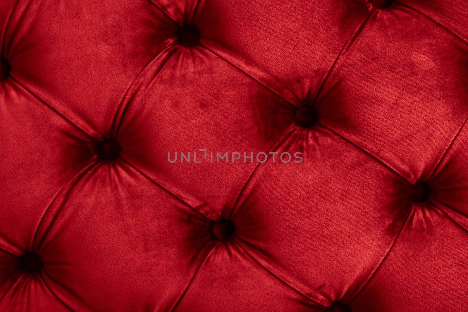 Red luxury velour quilted sofa upholstery with buttons, elegant home decor texture and background by Anneleven