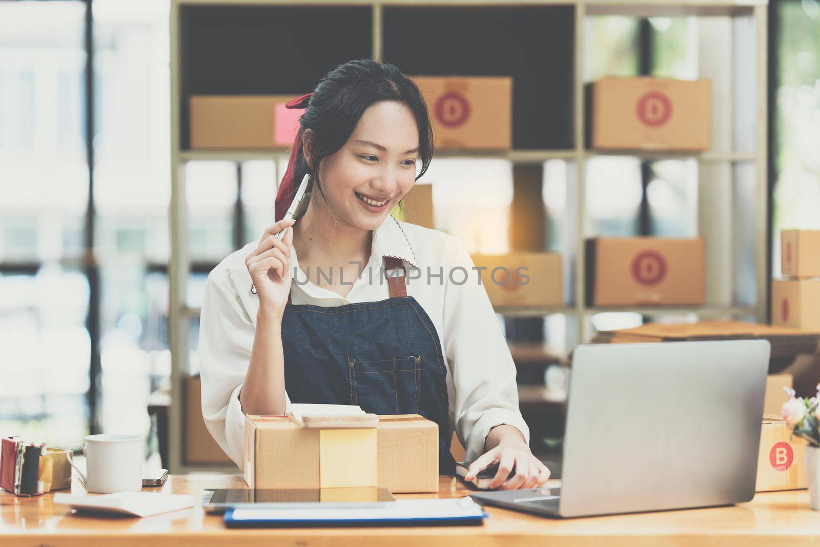 Asian small business owner working at home office. Business retail market and online sell marketing delivery, SME e-commerce concept.