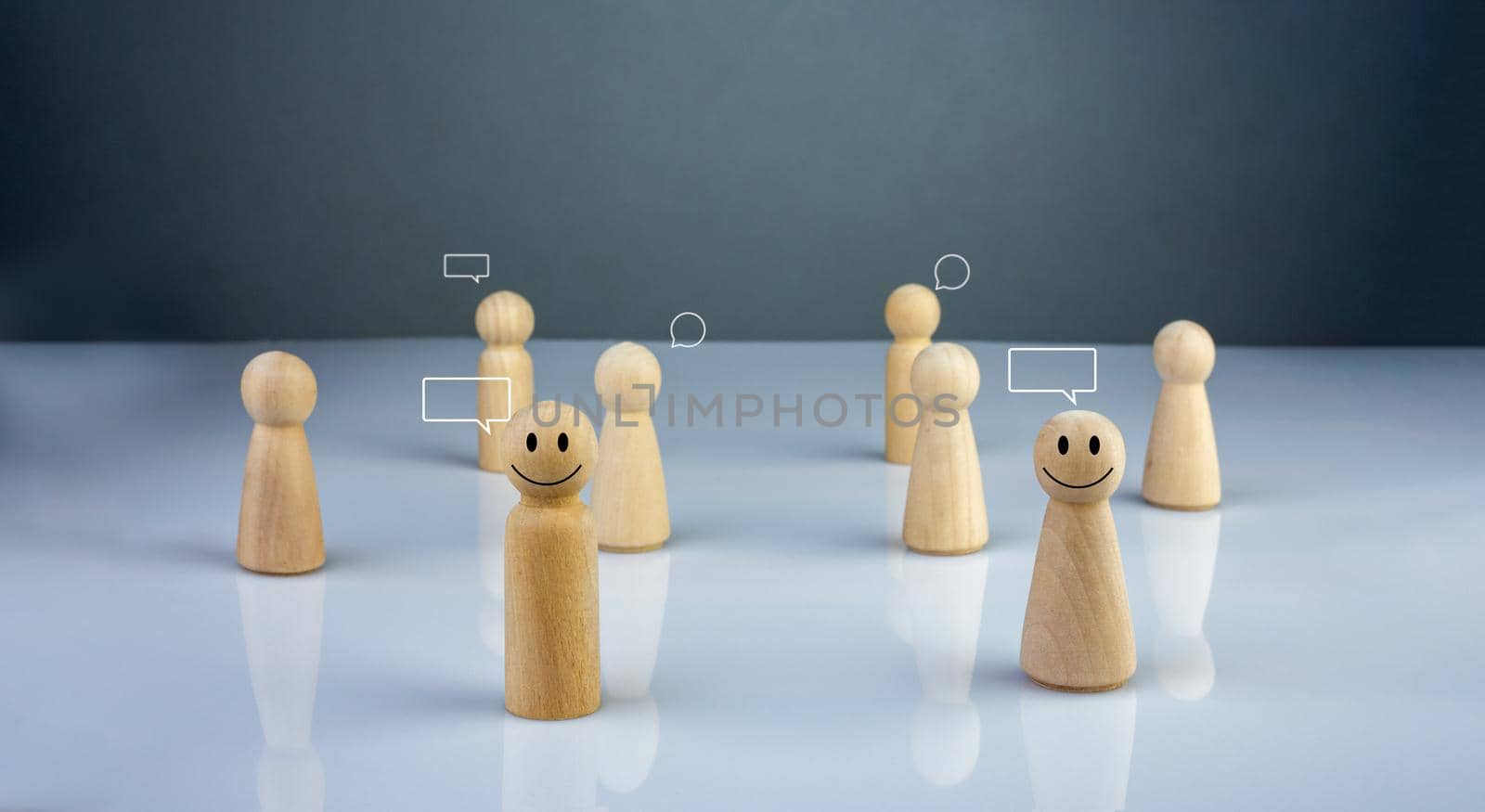 Wooden doll figure with communication and technology symbols. Social media and technology concept.