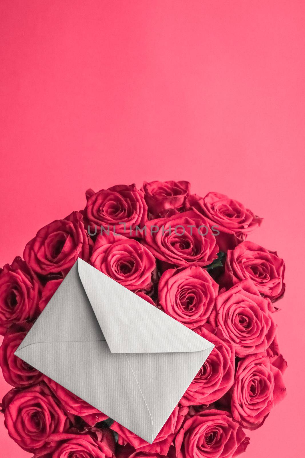 Holidays gift, floral present and happy relationship concept - Love letter and flowers delivery on Valentines Day, luxury bouquet of roses and card on pink background for romantic holiday design