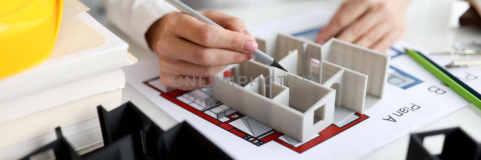 Architect shows layout of house or apartment. Design and construction of housing concept