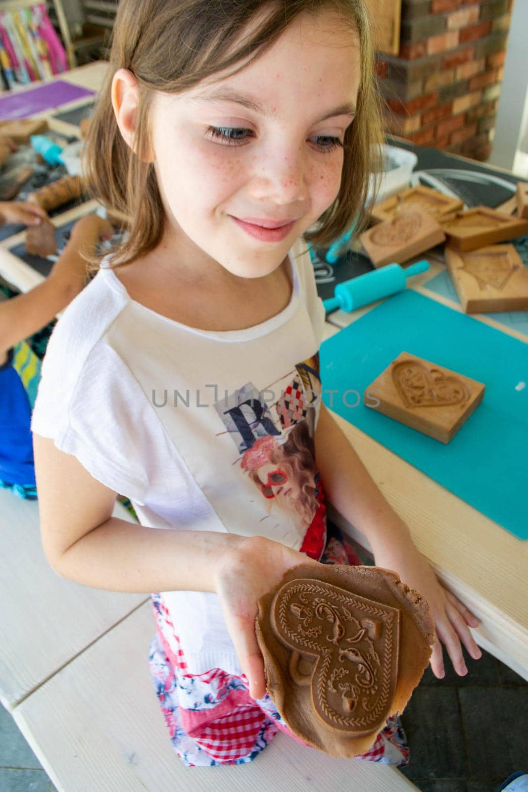 Children make homemade gingerbread cookies. High quality photo