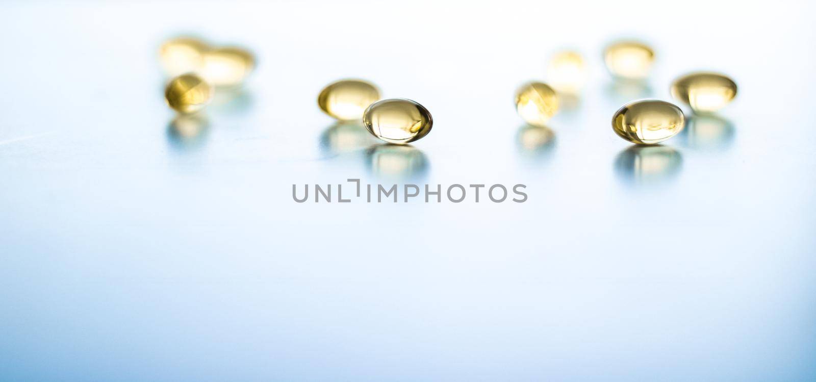 Pharmaceutical, branding and science concept - Vitamin D and golden Omega 3 pills for healthy diet nutrition, fish oil food supplement pill capsules, healthcare and medicine as pharmacy background