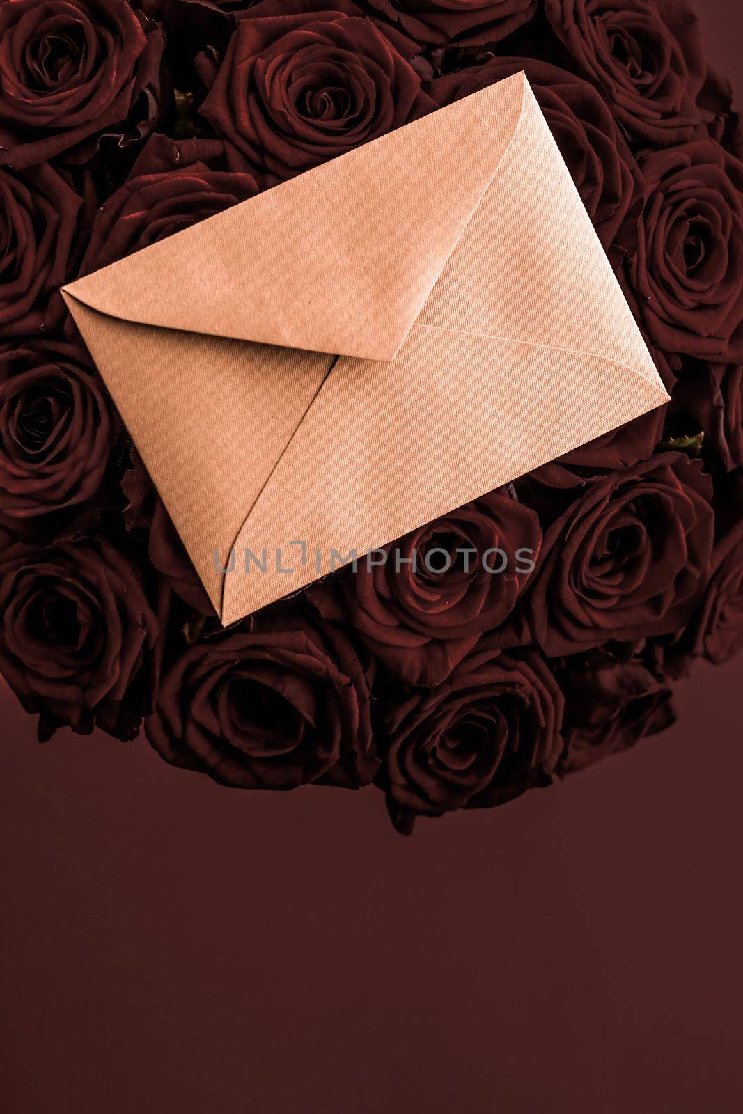 Holidays gift, floral present and happy relationship concept - Love letter and flowers delivery on Valentines Day, luxury bouquet of roses and card on chocolate background for romantic holiday design