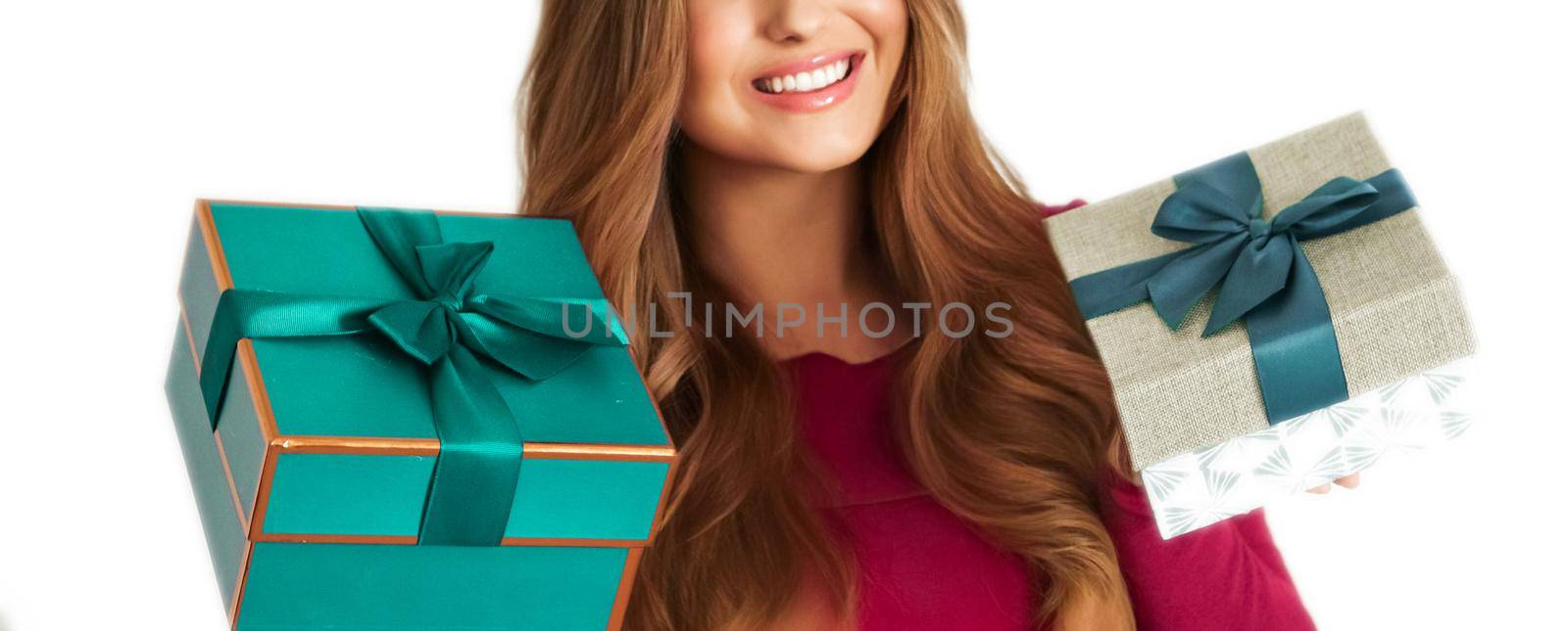 Birthday, Christmas gifts or holiday present, happy woman holding gift boxes isolated on white background, portrait