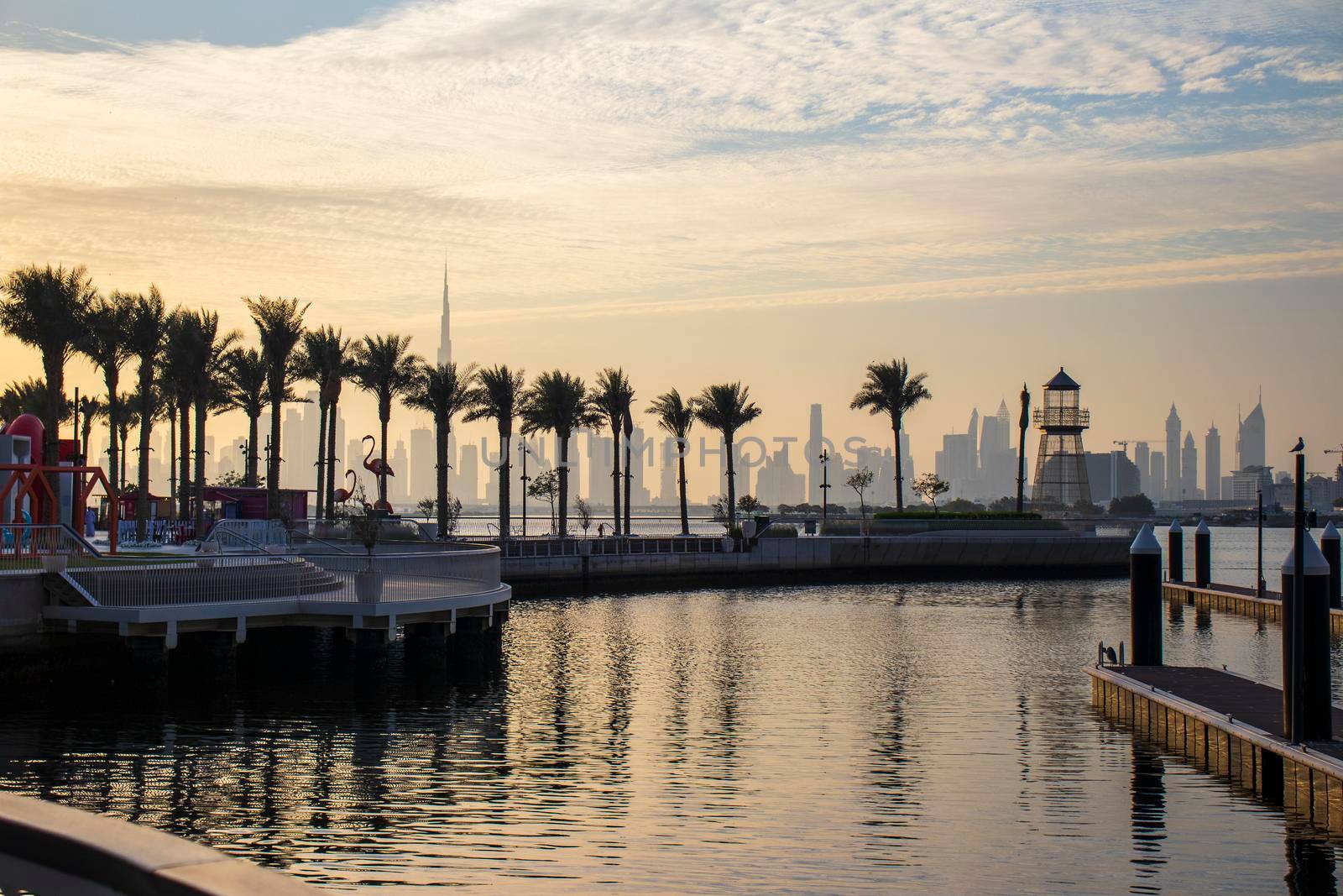 View of a Dubai city skyline from the wharf on Dubai creek harbour. UAE.