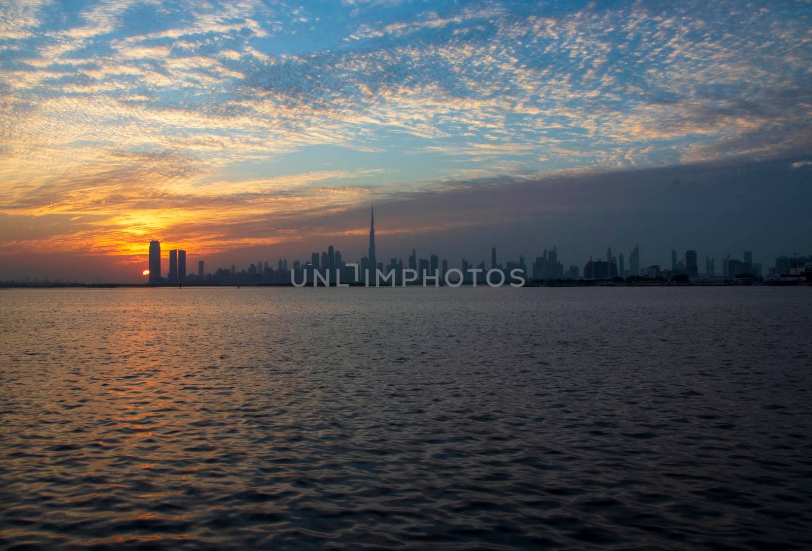 Dramatic sunset over a Dubai city. UAE.