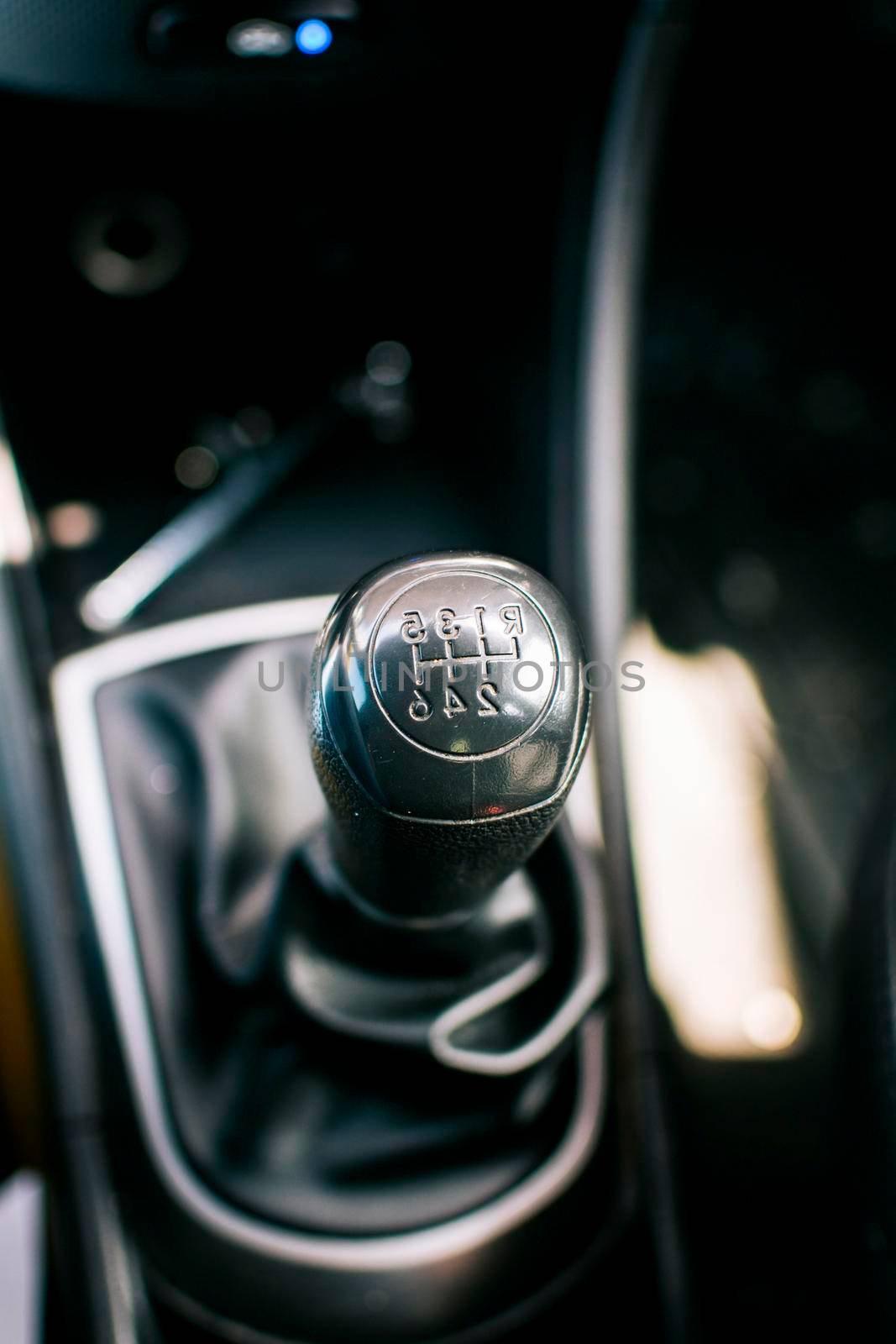 Gear lever of a vehicle. Close-up of a car gear lever, Close up of a car gear knob. Detail view of a vehicle transmission lever
