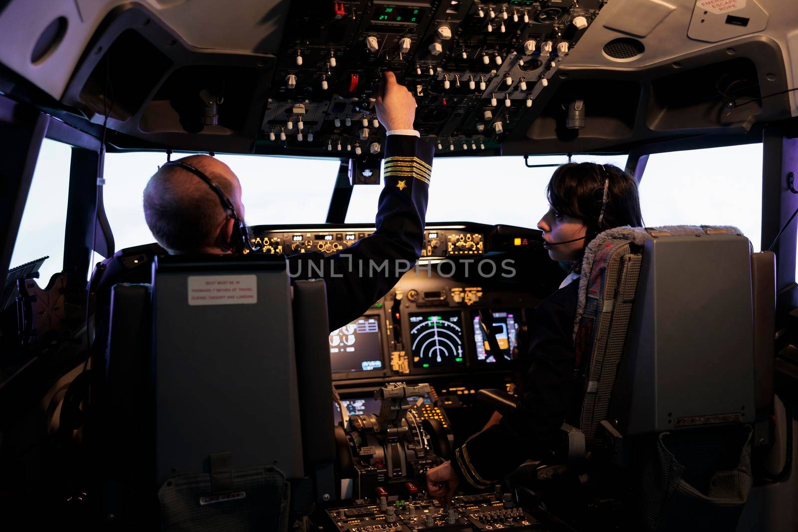 Airliners team flying airplane with dashboard command, using control panel and navigation windscreen. Piloting aircraft with power lever switch and handle in aviation cockpit cabin.