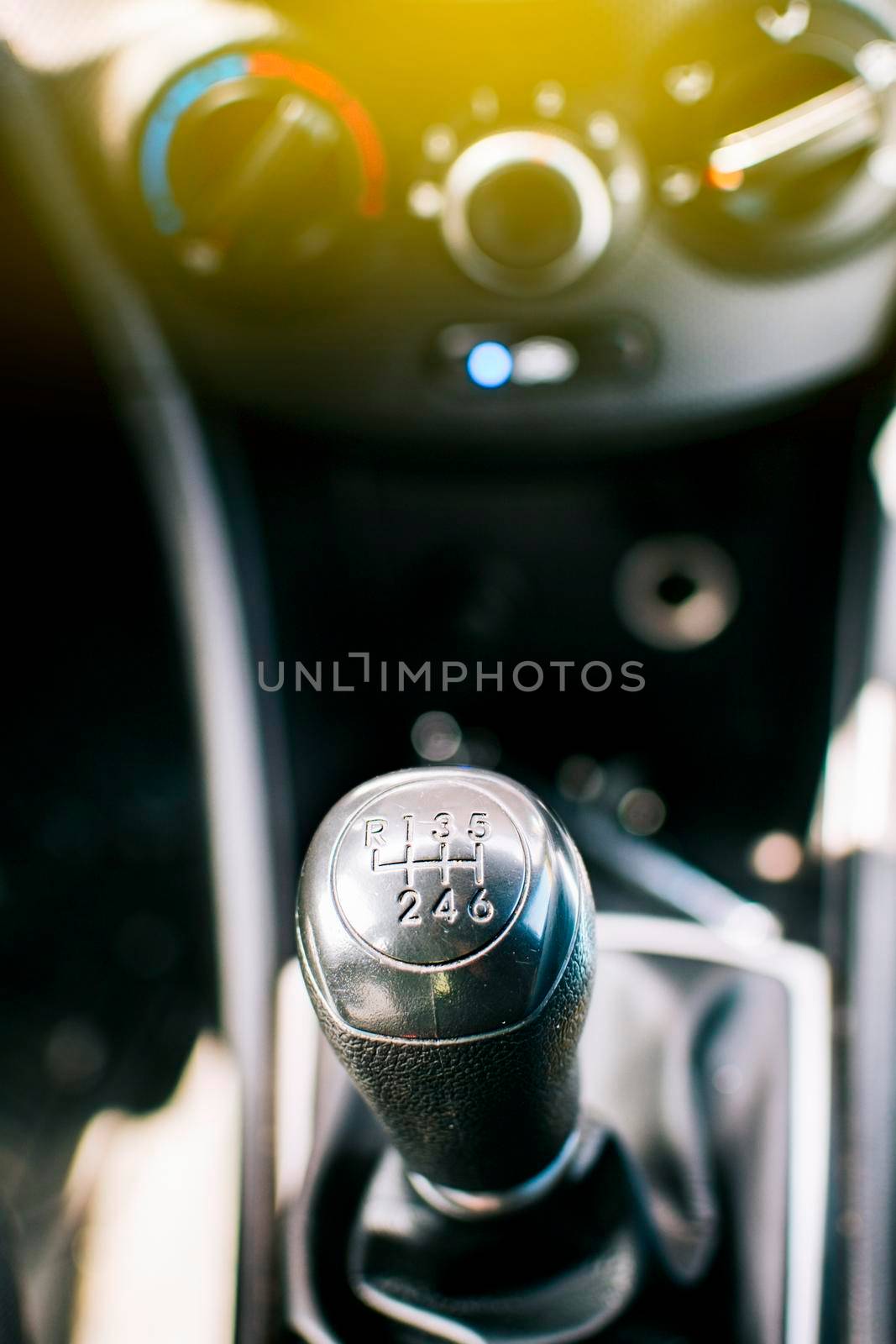 Close up of a car gear knob. Detail view of a vehicle transmission lever, Gear lever of a vehicle. Close-up of a car gear lever