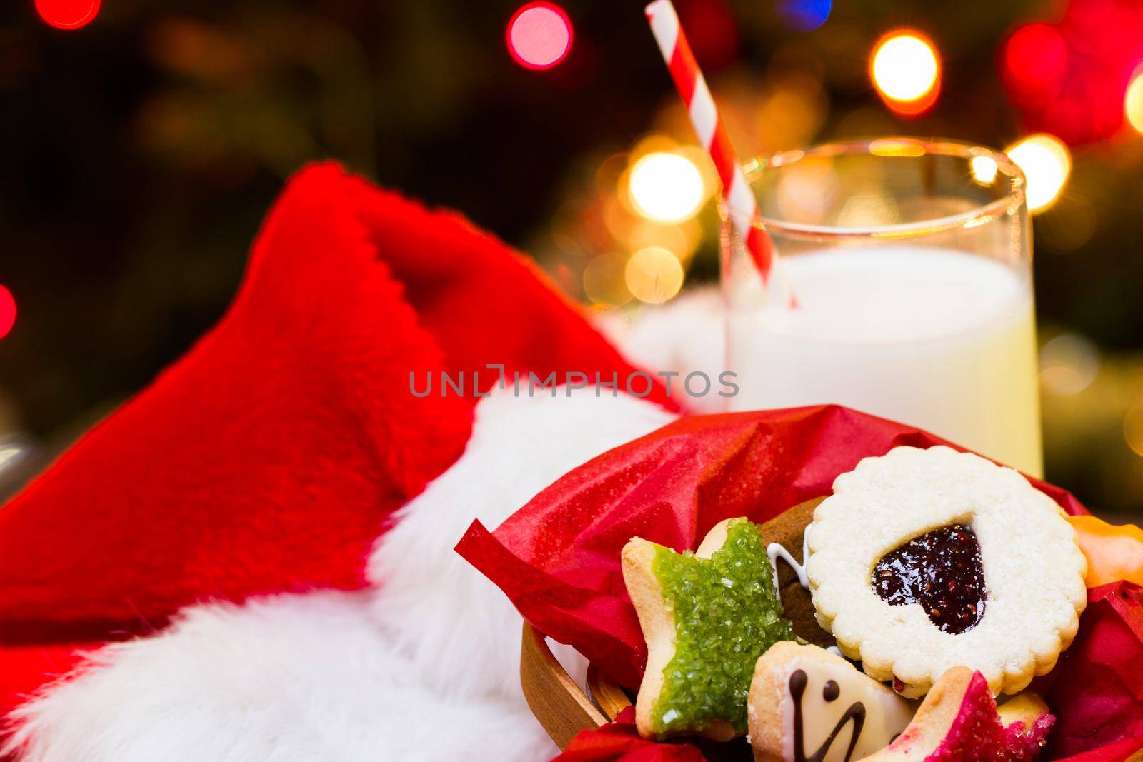 Assorted christmas cookies on red background.