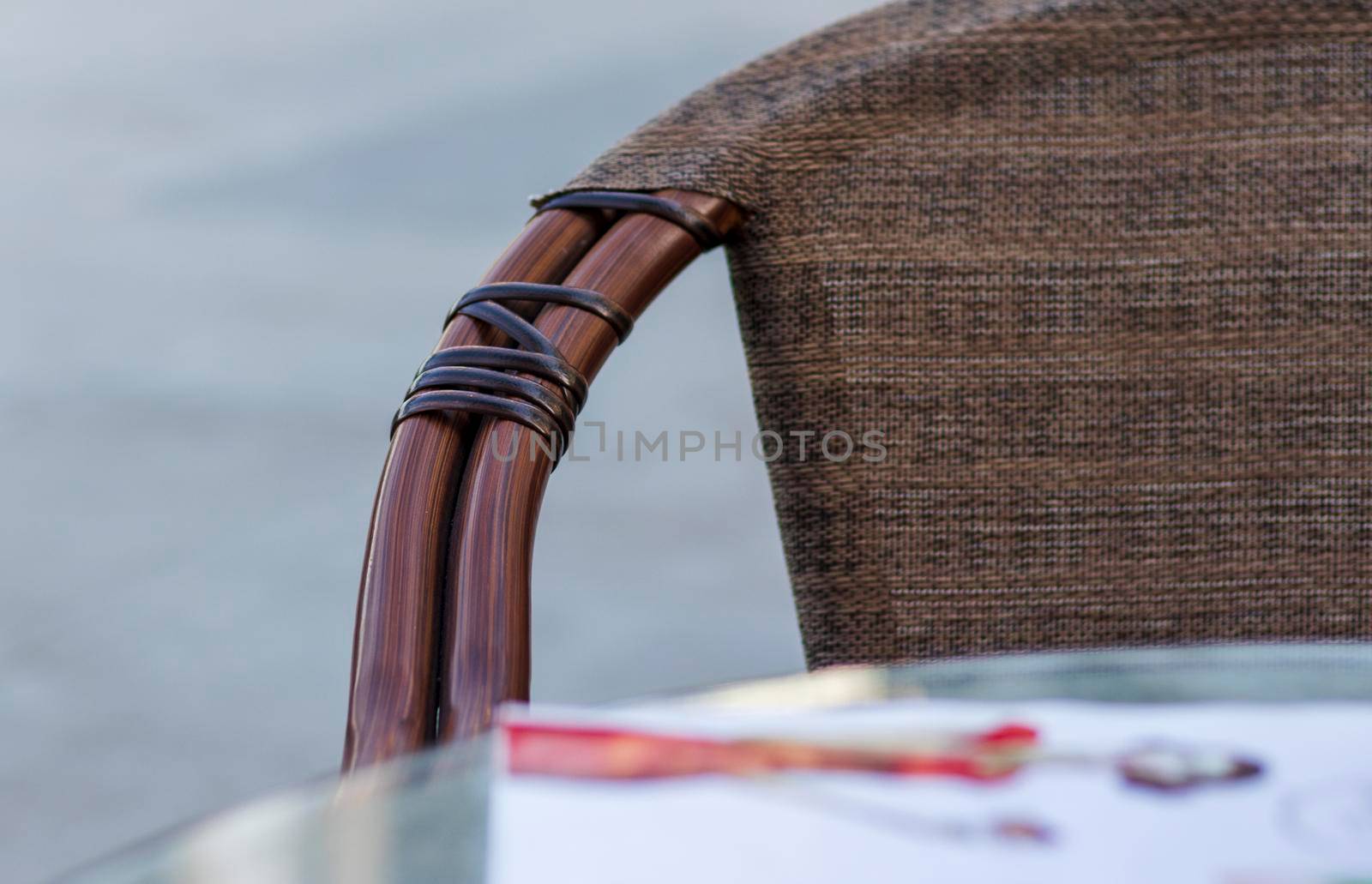 Close up shot of outdoors wicker furniture. Cafe by pazemin