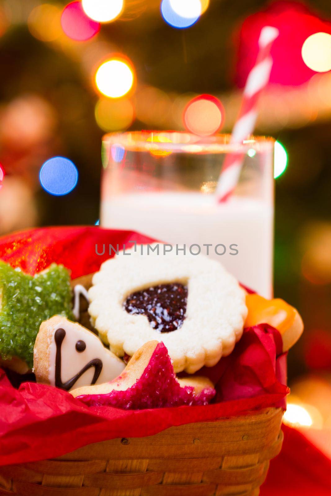 Assorted christmas cookies on red background.