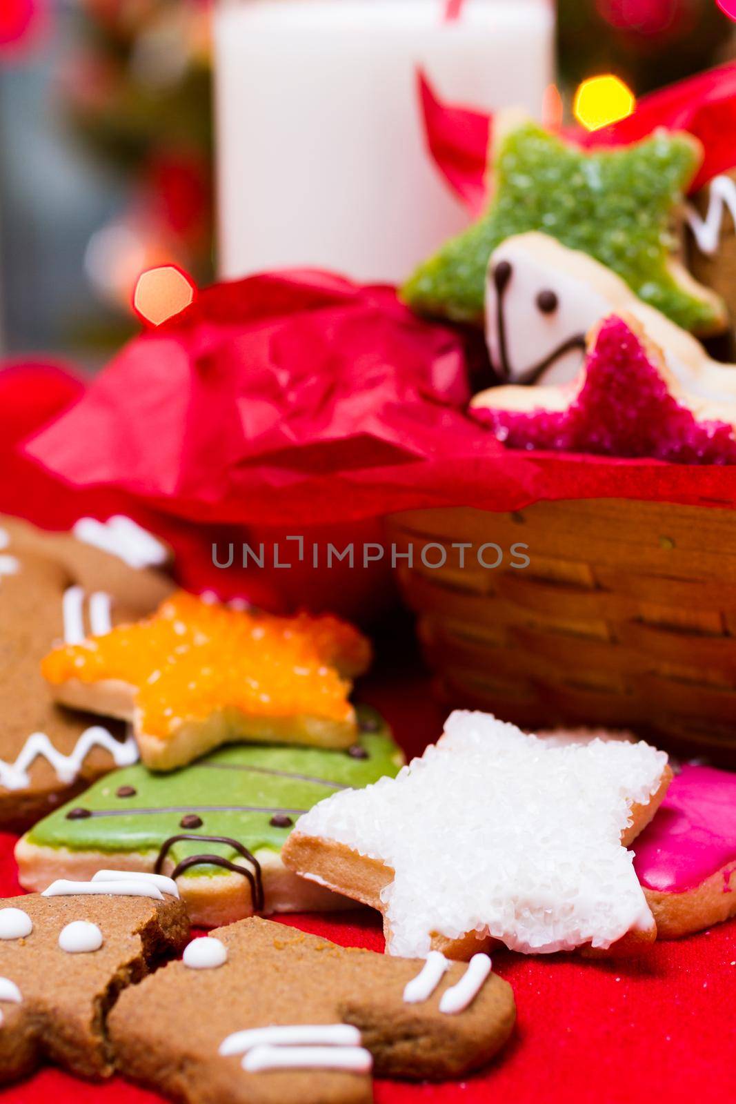 Assorted christmas cookies on red background.