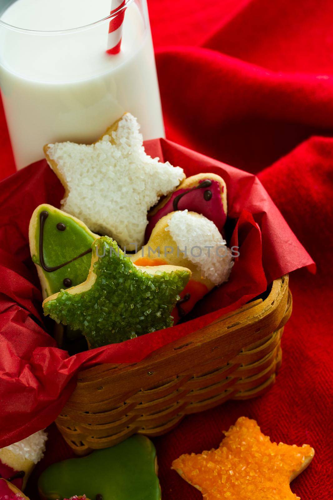 Assorted christmas cookies on red background.