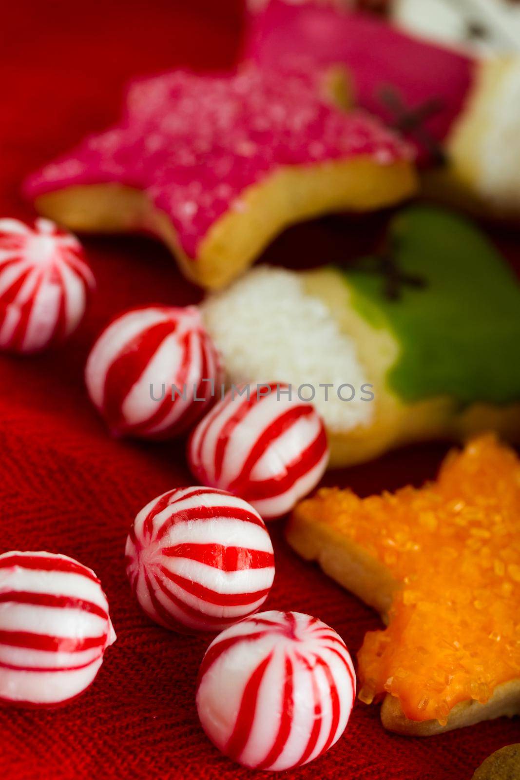 Assorted christmas cookies on red background.