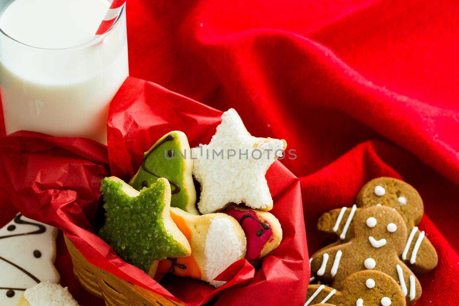 Assorted christmas cookies on red background.