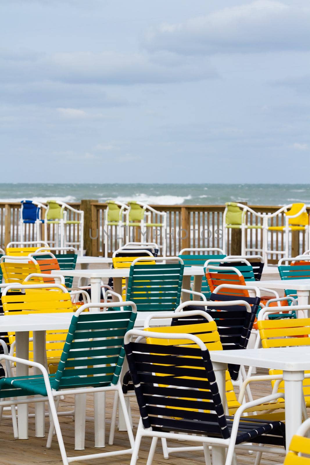 Empty patio with multi color chair.