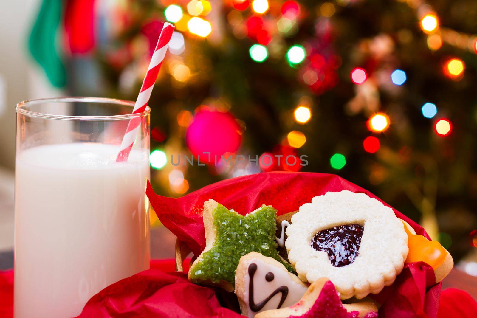 Assorted christmas cookies on red background.