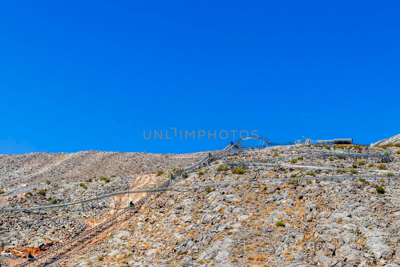 Outdoor roller coaster attraction in the mountains