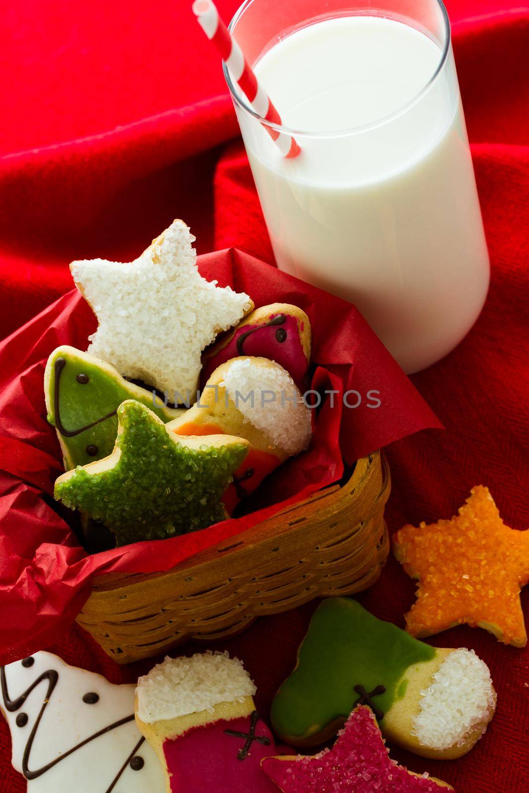 Assorted christmas cookies on red background.