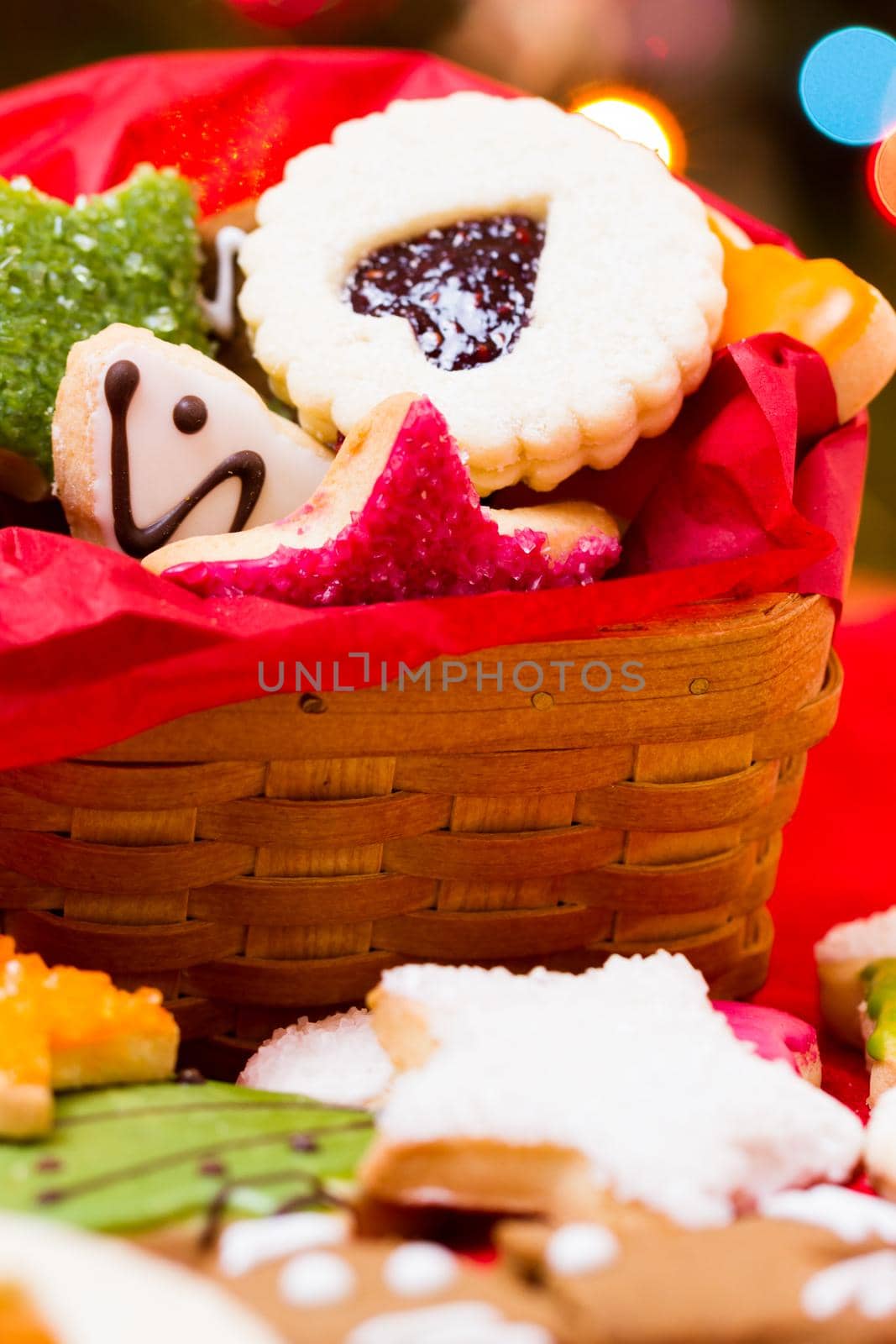 Assorted christmas cookies on red background.