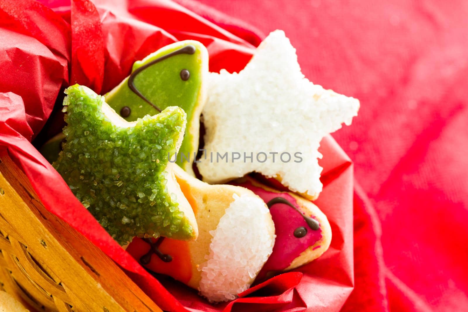 Assorted christmas cookies on red background.