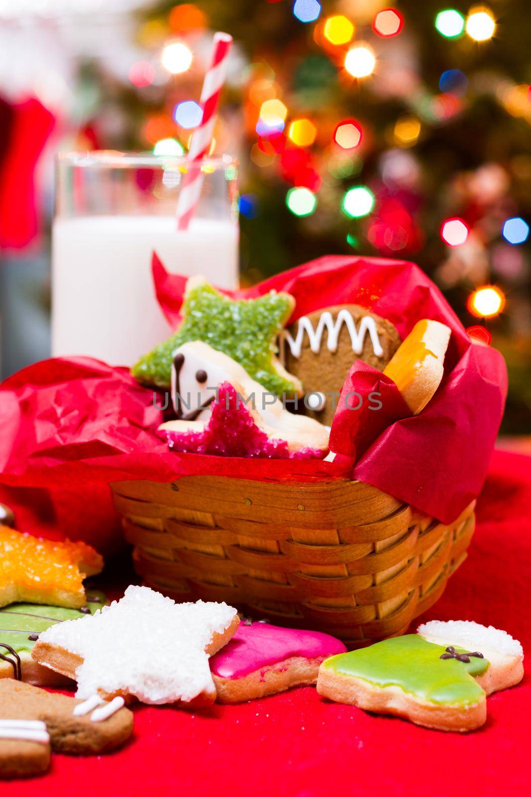 Assorted christmas cookies on red background.