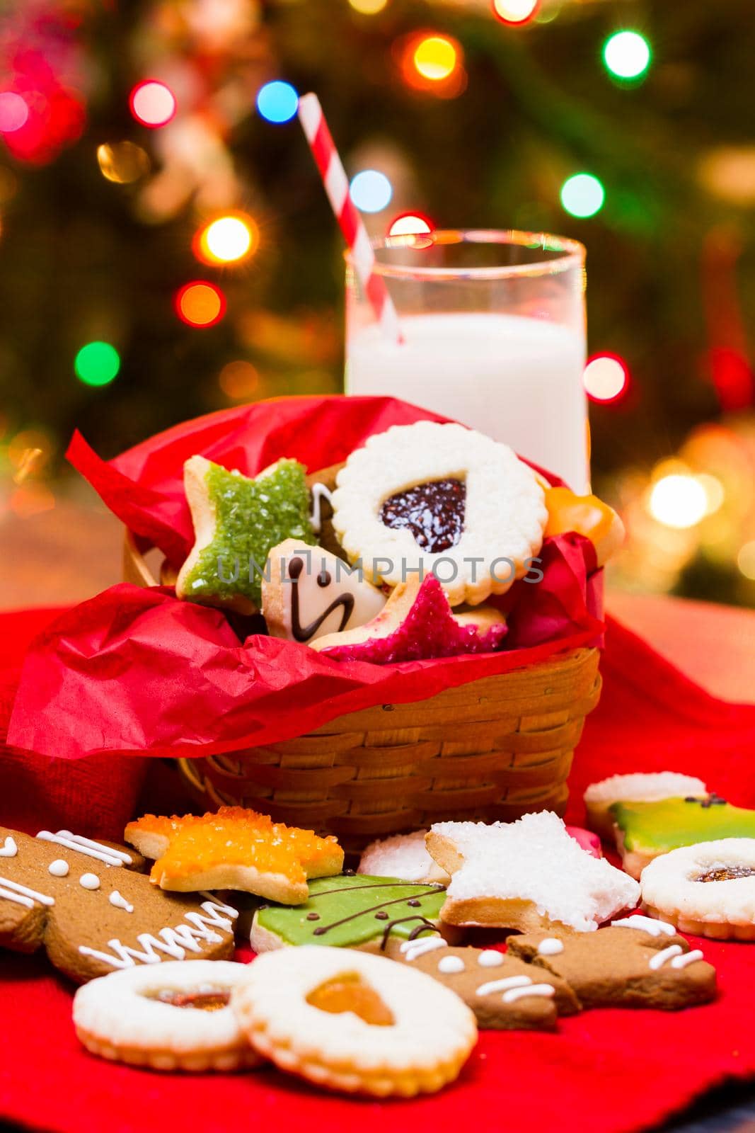 Assorted christmas cookies on red background.