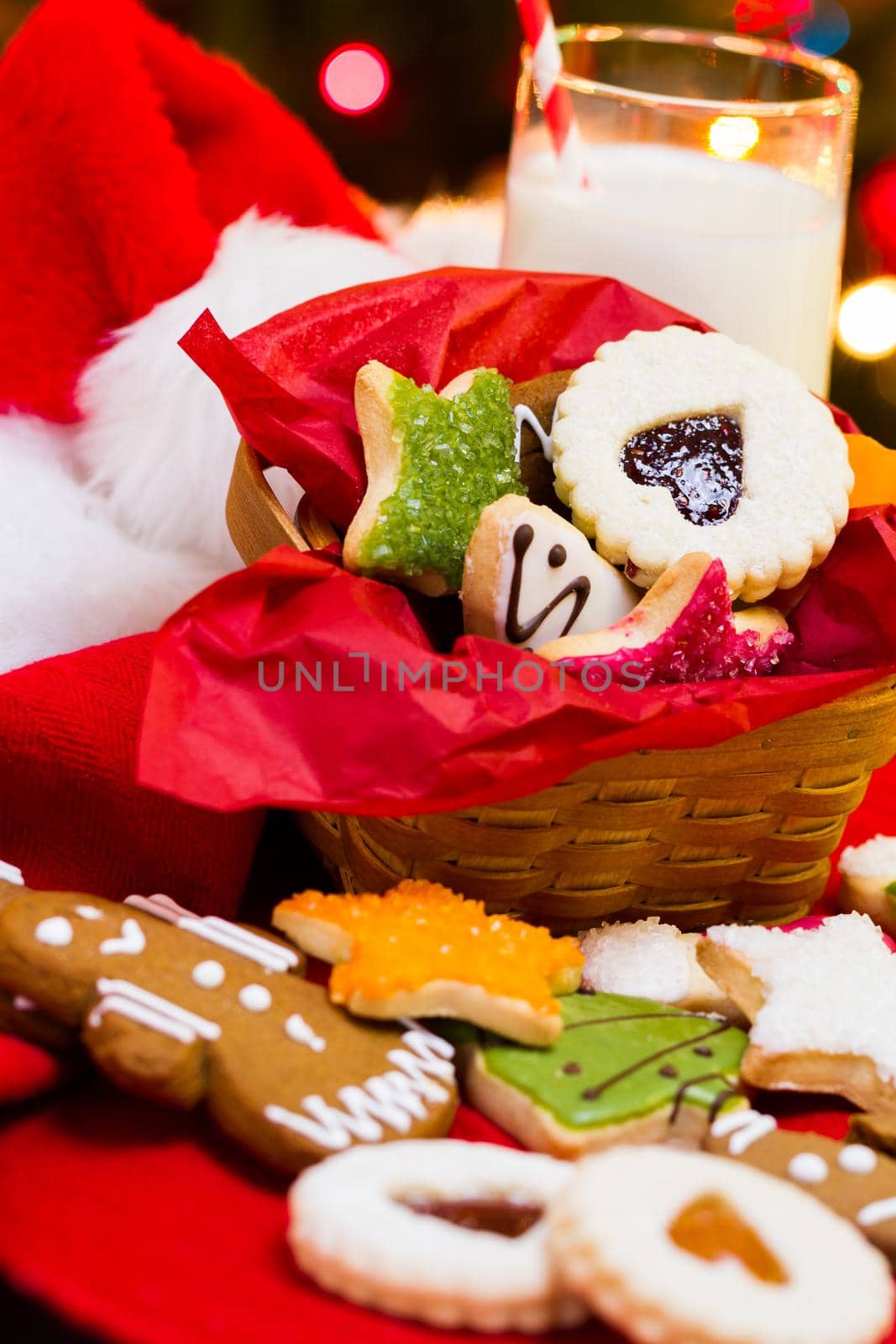 Assorted christmas cookies on red background.