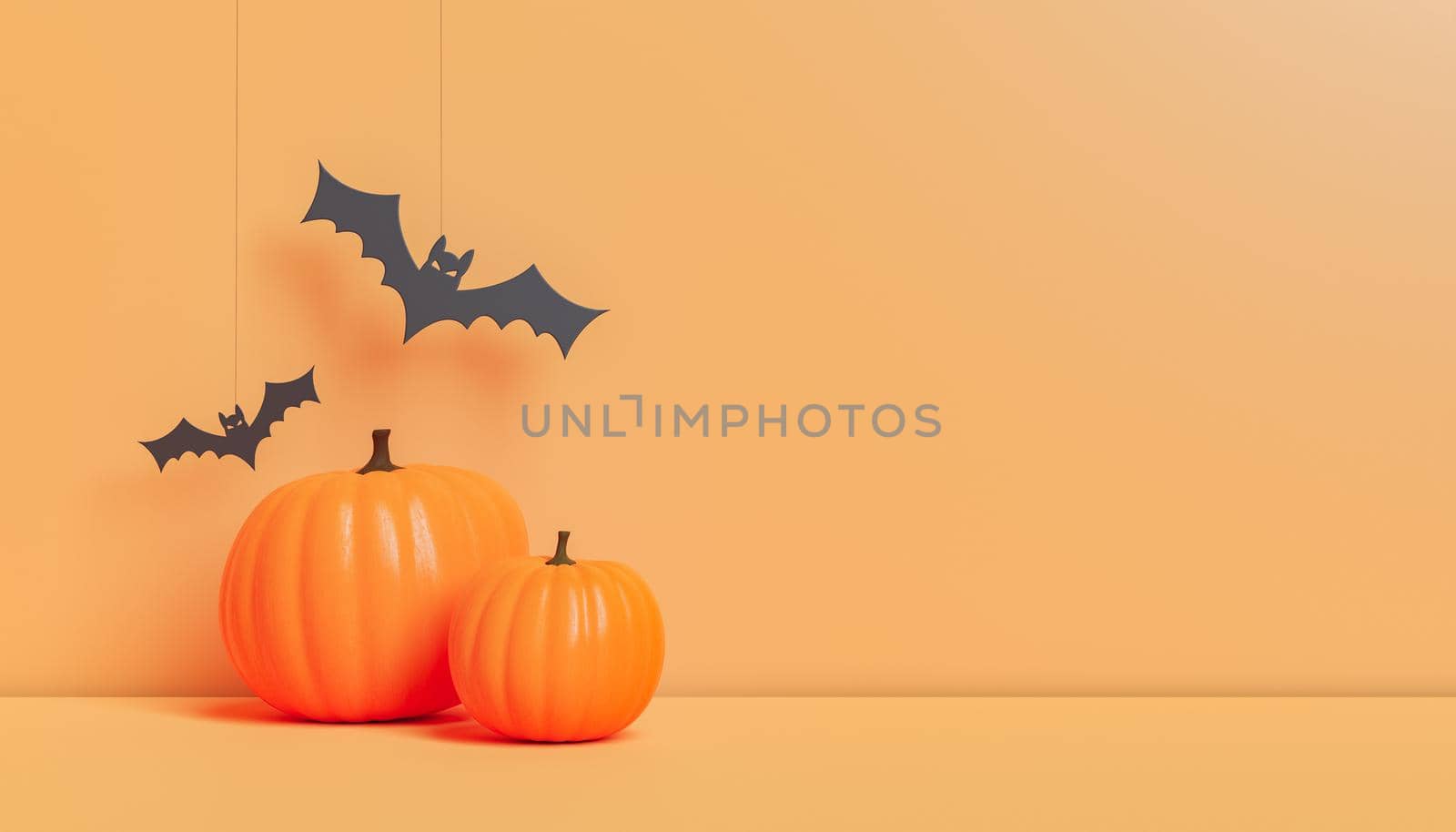 Halloween decorations with pumpkins and paper bats in studio by asolano