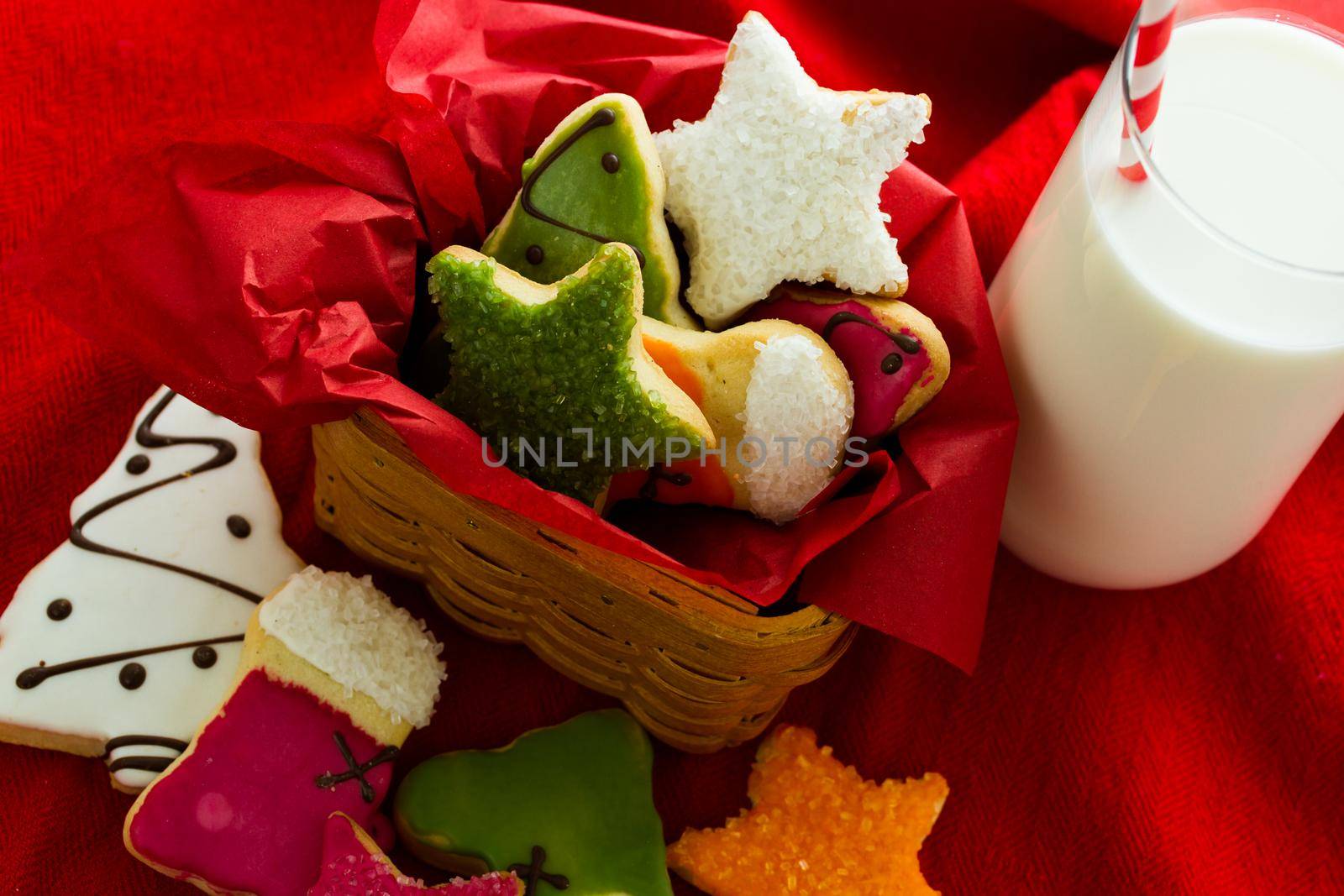 Assorted christmas cookies on red background.