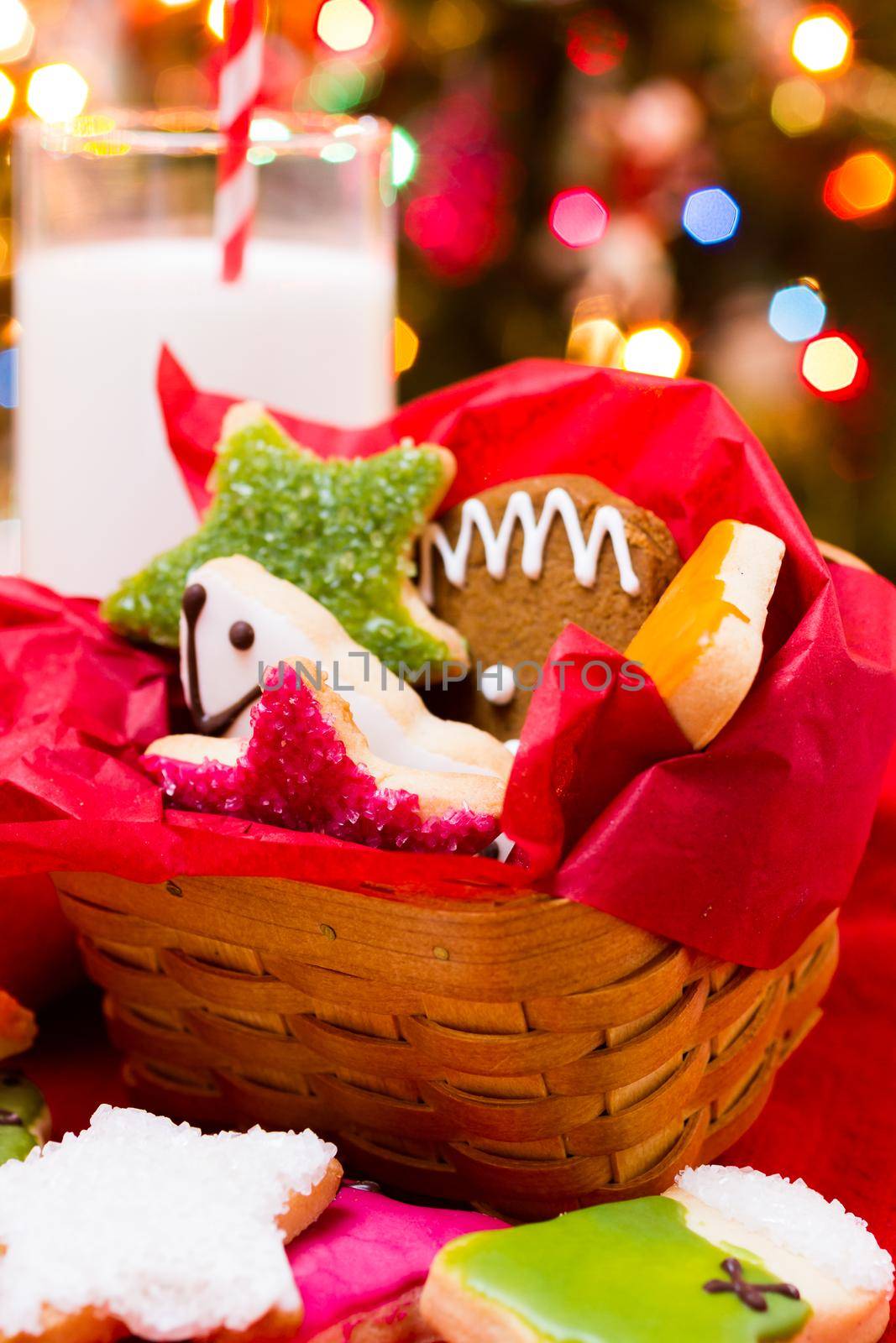 Assorted christmas cookies on red background.