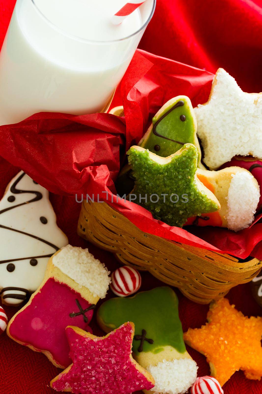 Assorted christmas cookies on red background.