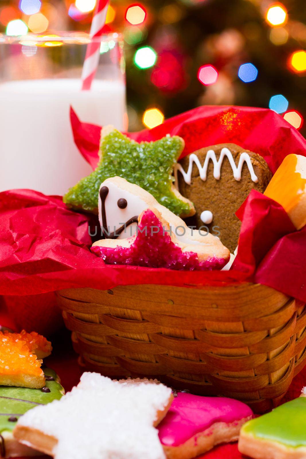 Assorted christmas cookies on red background.