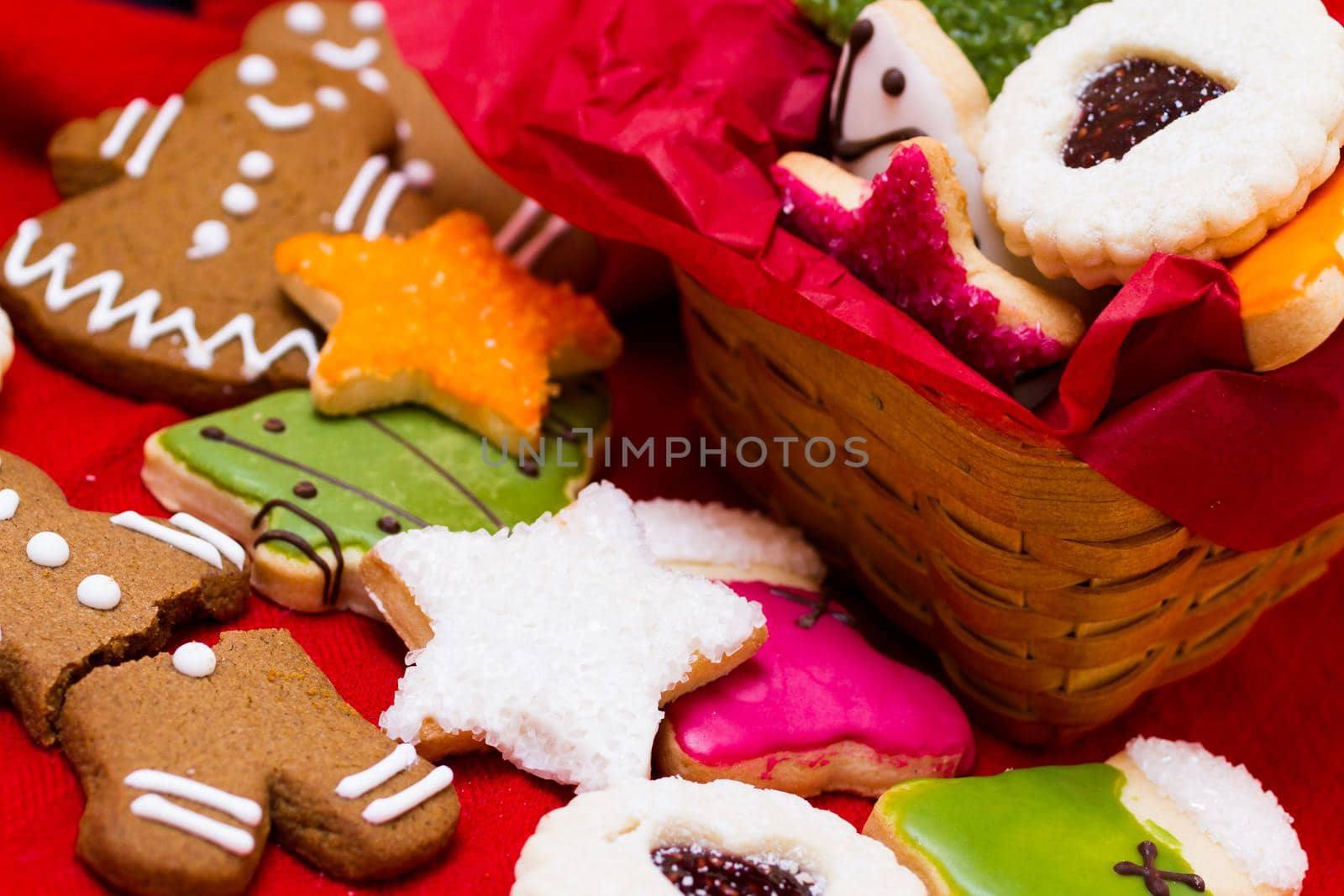 Assorted christmas cookies on red background.
