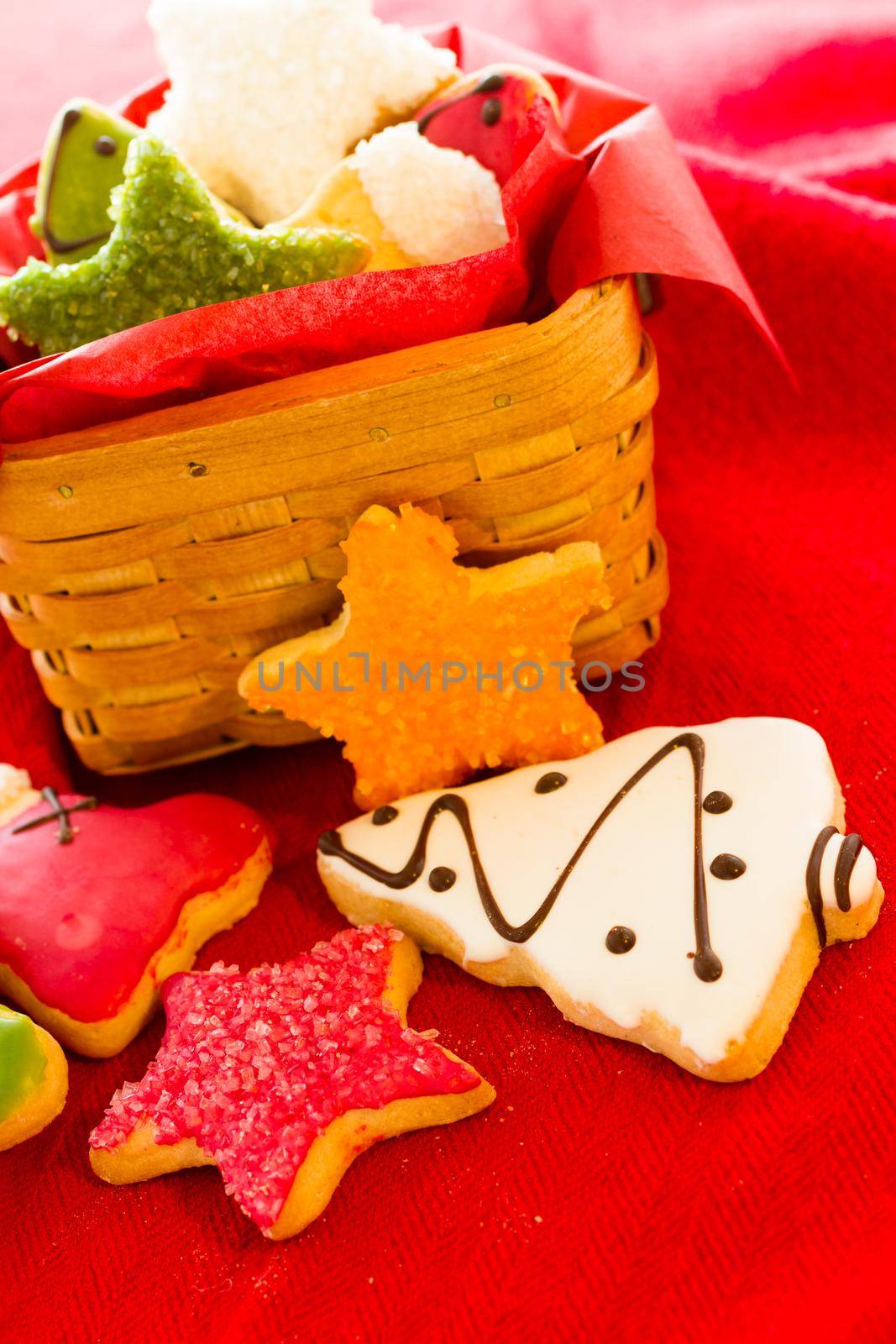 Assorted christmas cookies on red background.