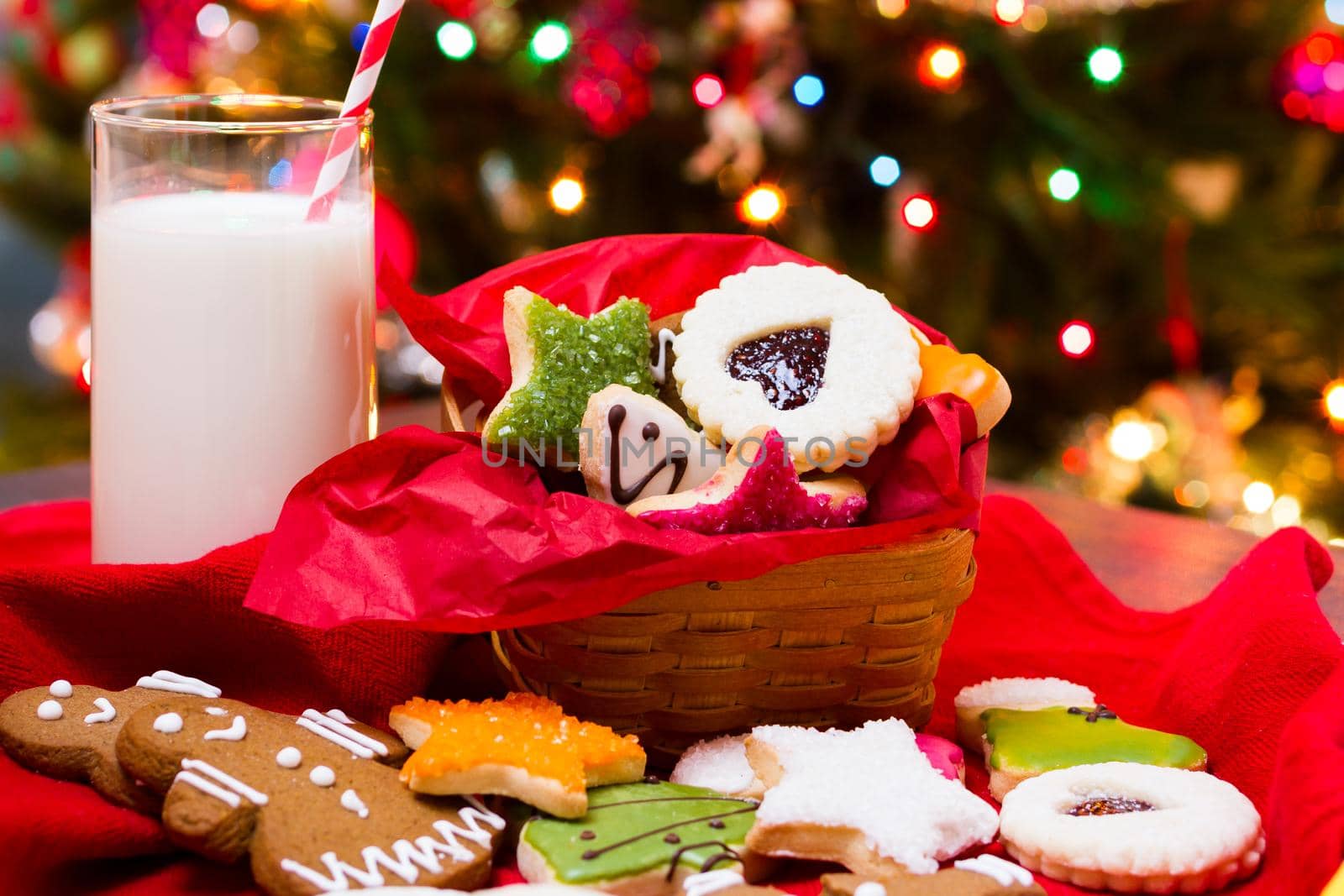 Assorted christmas cookies on red background.