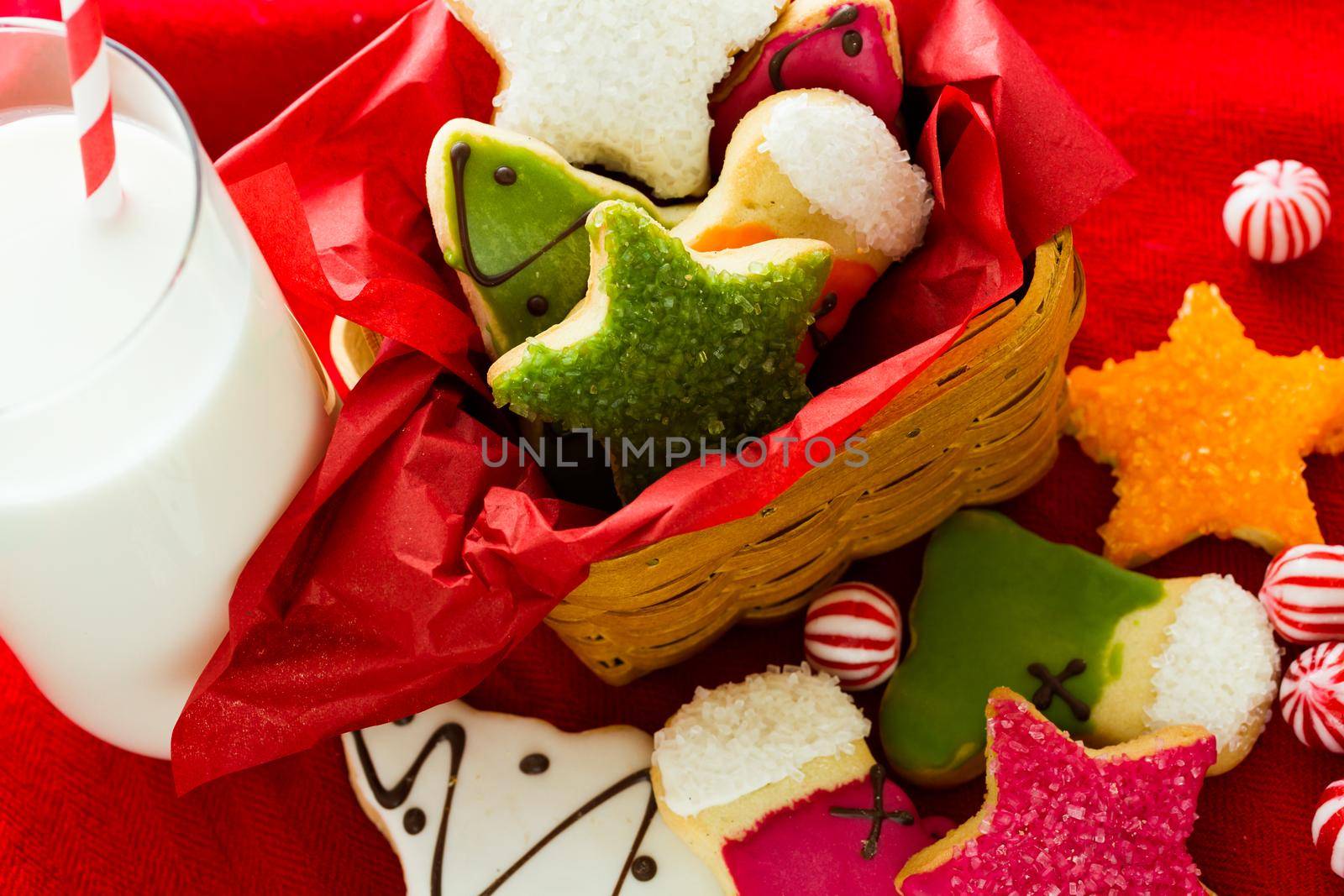 Assorted christmas cookies on red background.