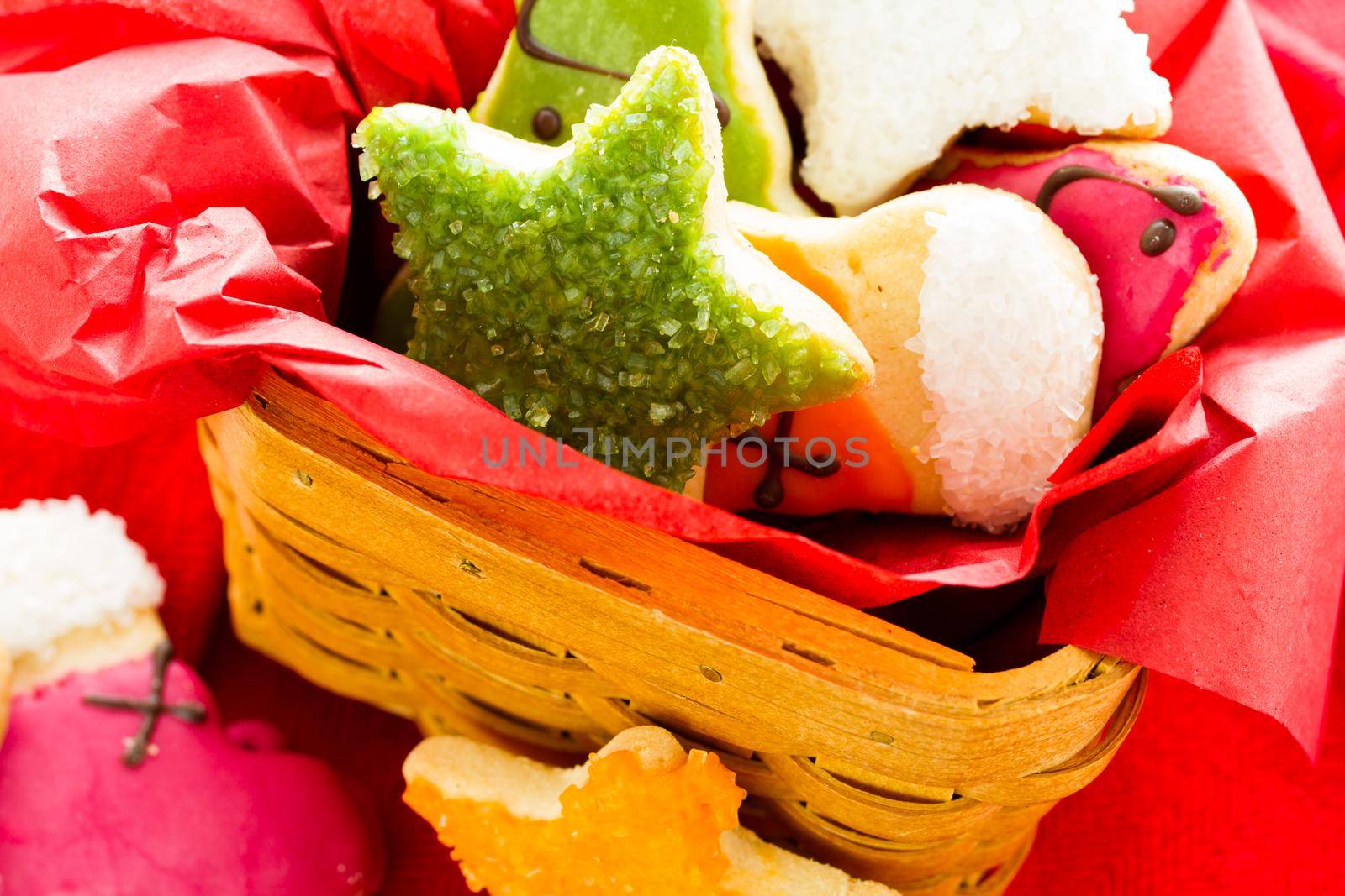 Assorted christmas cookies on red background.