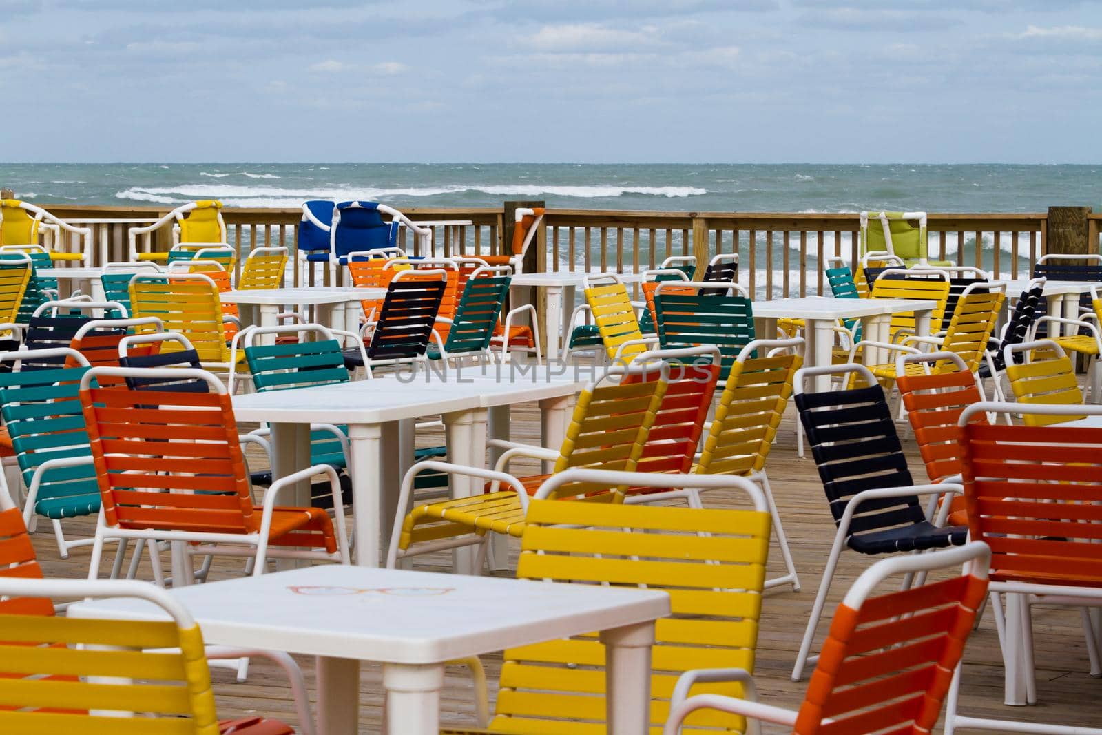 Empty patio with multi color chair.