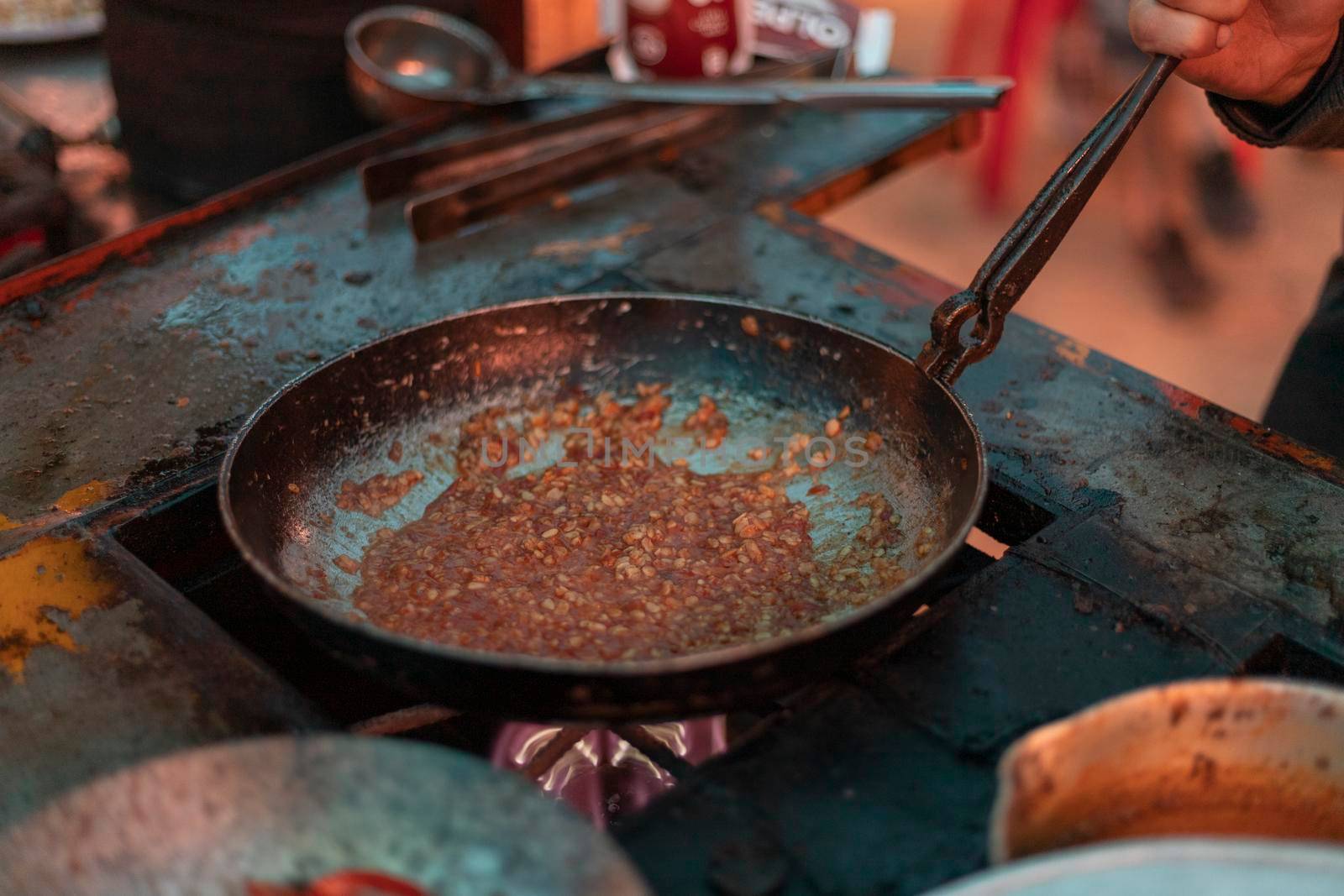 Frying dal pulses in a fry pan. Dal Tadka or Daal fry Pakstani and indian cuisine tasty food. by Bilalphotos