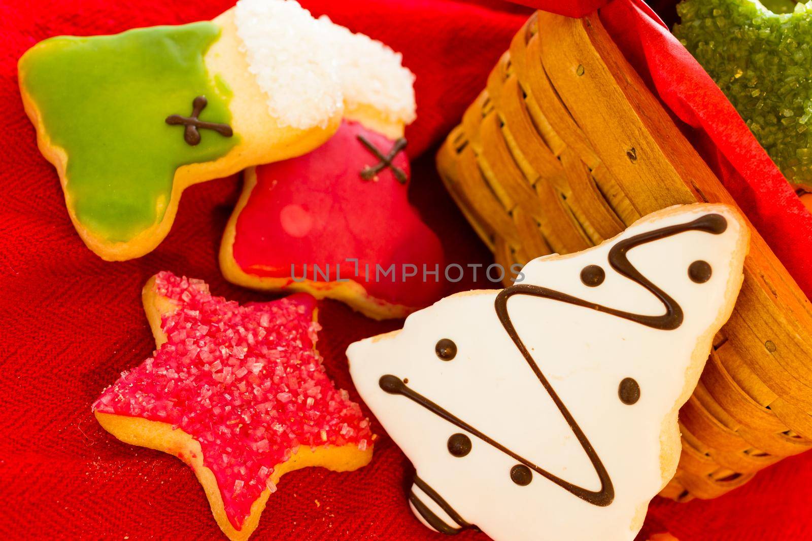 Assorted christmas cookies on red background.