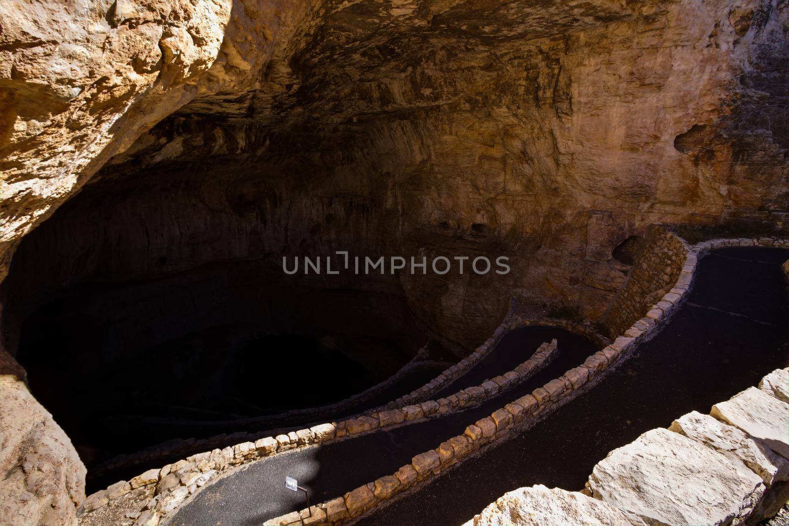 Switchback footpath winds into natural opening of Carlsbad Caverns.