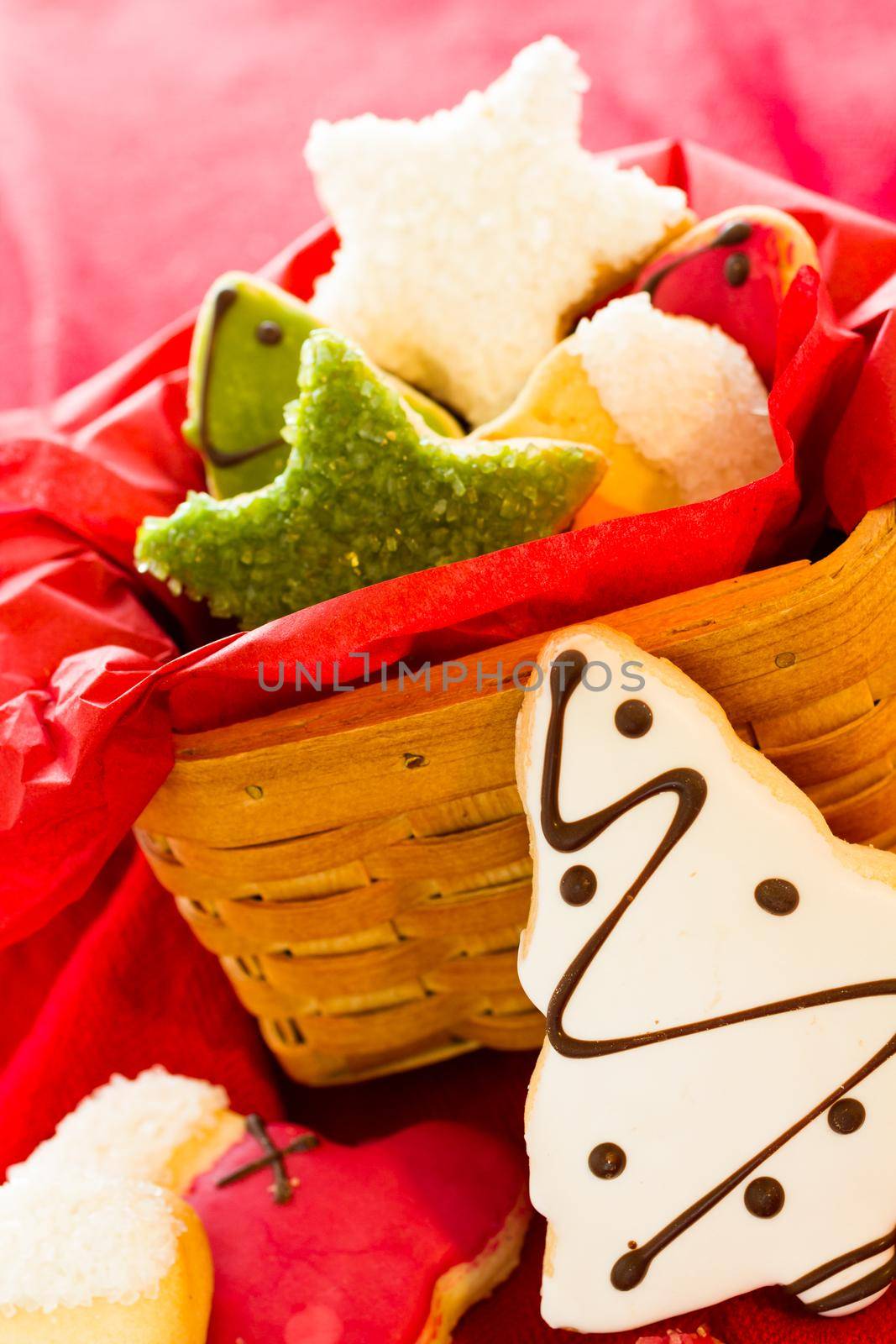 Assorted christmas cookies on red background.